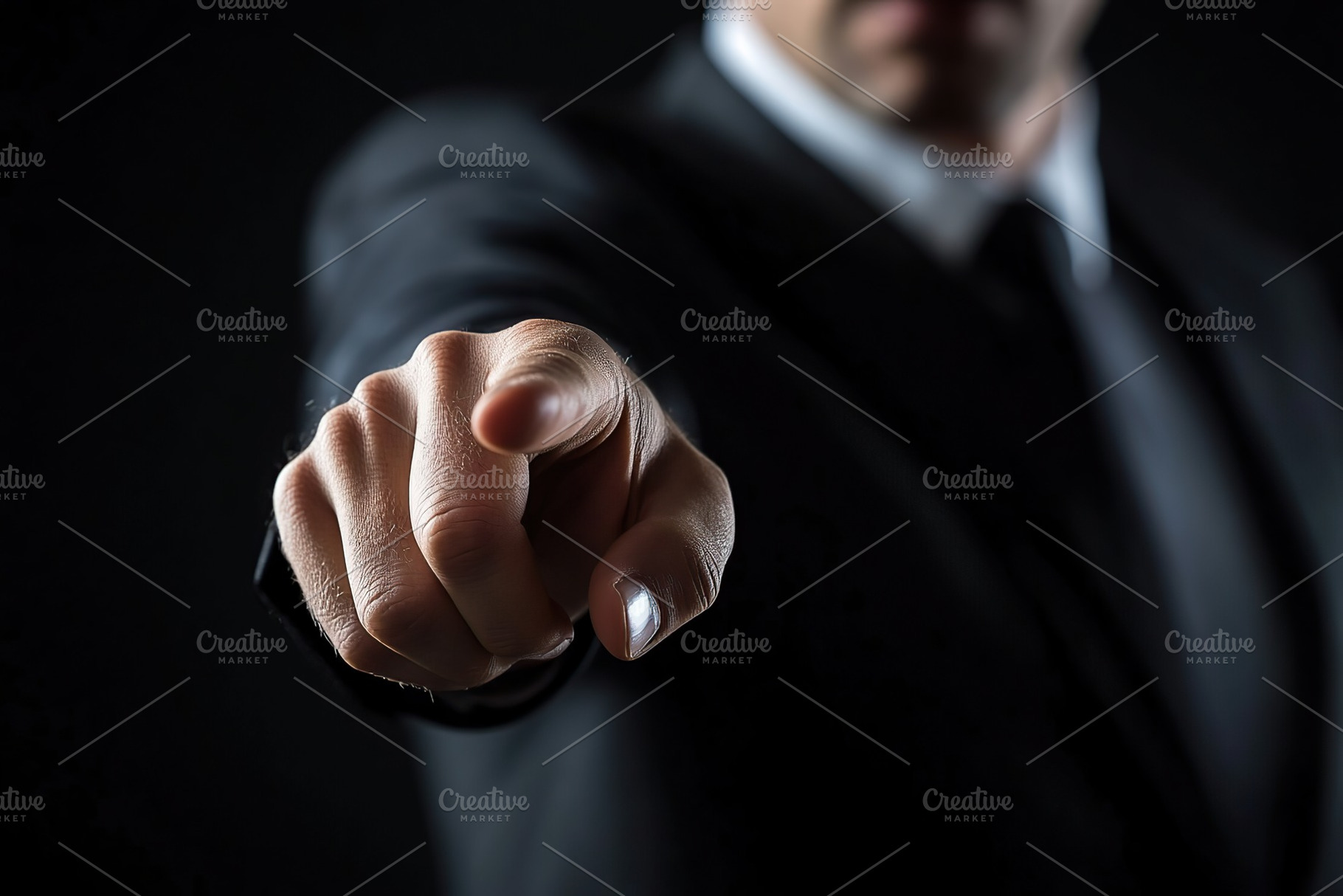 Confident businessman pointing forward in a dark setting during a professional, a Photo by AlyaAnd