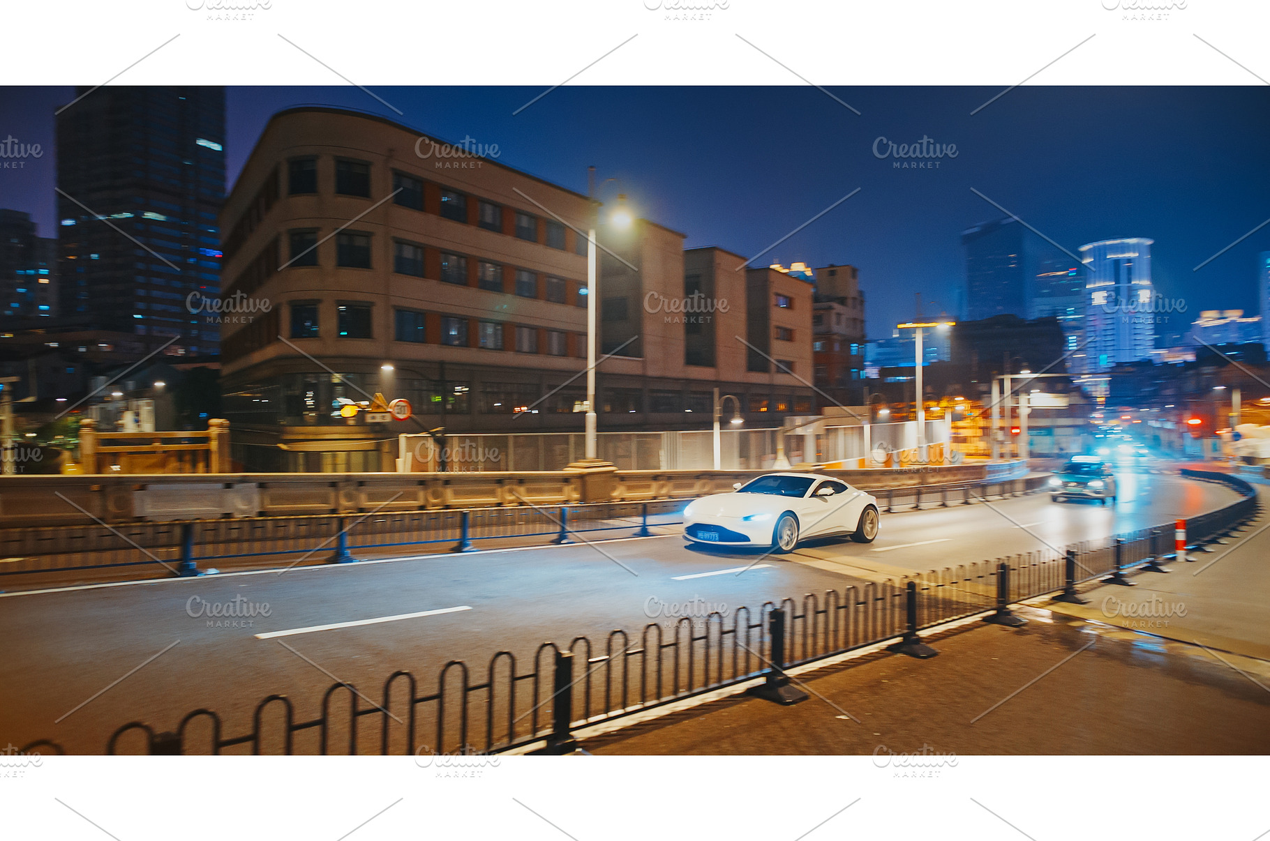 White supercar in fast motion at, a Transportation Photo by Our Amazing World