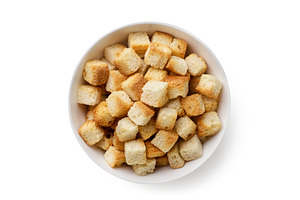 Bread croutons in a plate on a white, a Food & Drink Photo by innakreativ