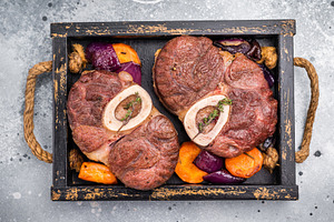 Flavorful ossobuco garnished with fresh herbs, osso buco shank i, a Food & Drink Photo by composter-box@mail.ru