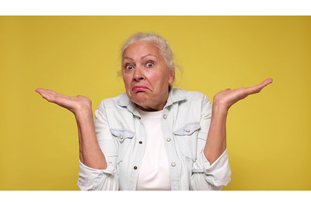 Senior European woman shrugs her