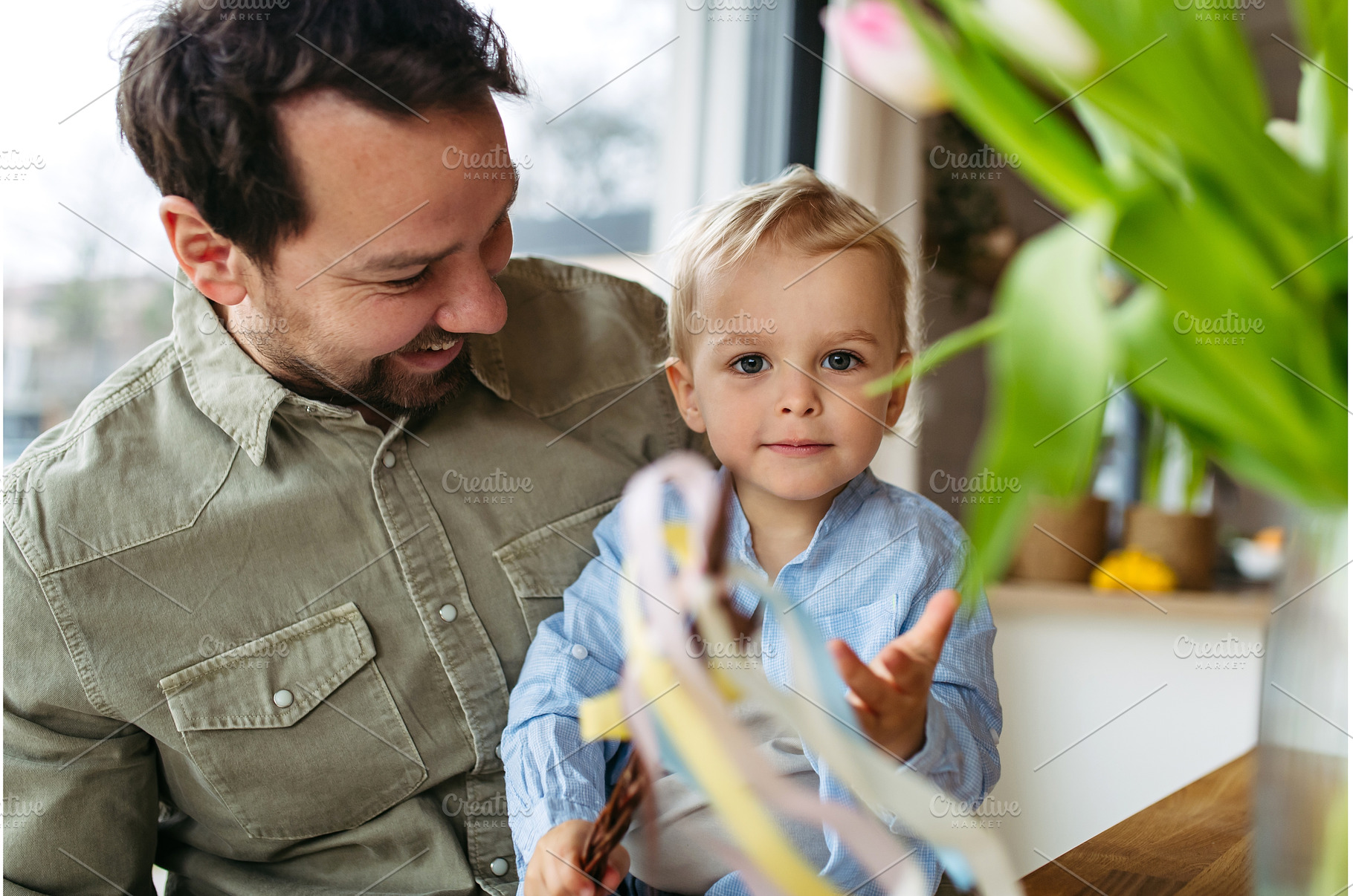 Father and little boy holding easter, a Holiday Photo by HalfPoint