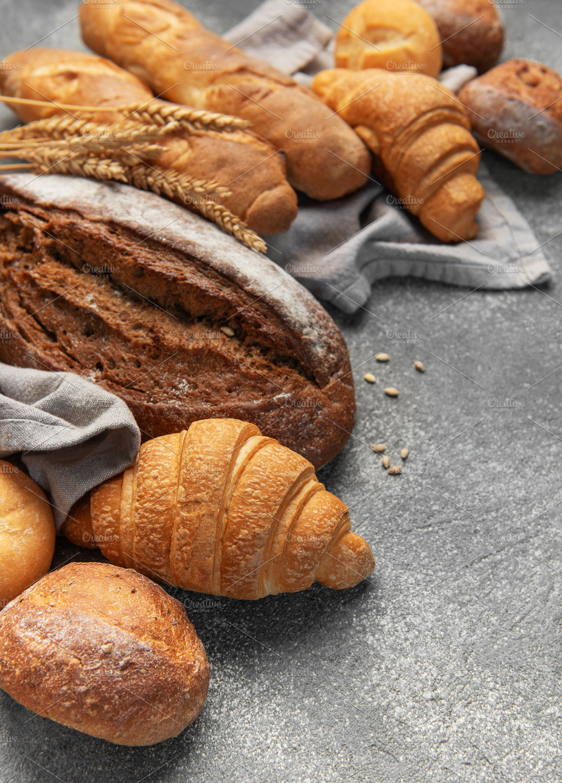 Fresh baked bread, baguettes, croissants, and buns assortment, a Food & Drink Photo by Olena Rudo