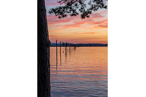 Dramatic sunset clouds over, a Nature Photo by Backyard Stock