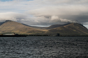Scenic view of Akranes mountains and waterfront in Iceland under cloudy skies, a Photo by AS photostudio
