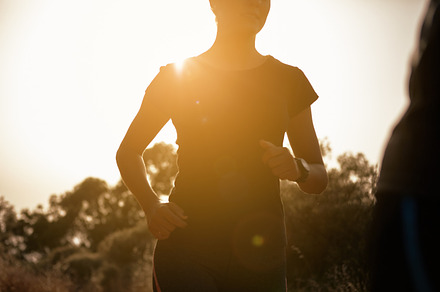 Running in the mountains containing female, young, and happy