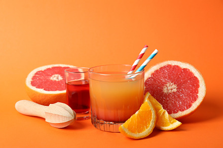 Concept of cooking Tequila sunrise cocktail on orange background, a Food & Drink Photo by AtlasStudio PRO