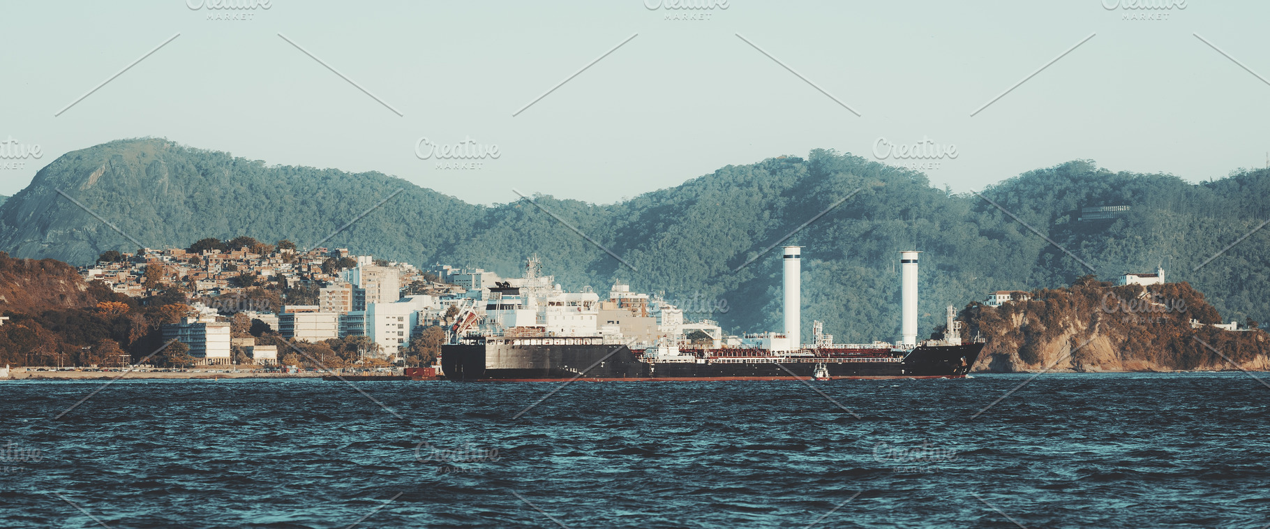 Rotor sail cargo ship near coast, a Transportation Photo by SkyNext