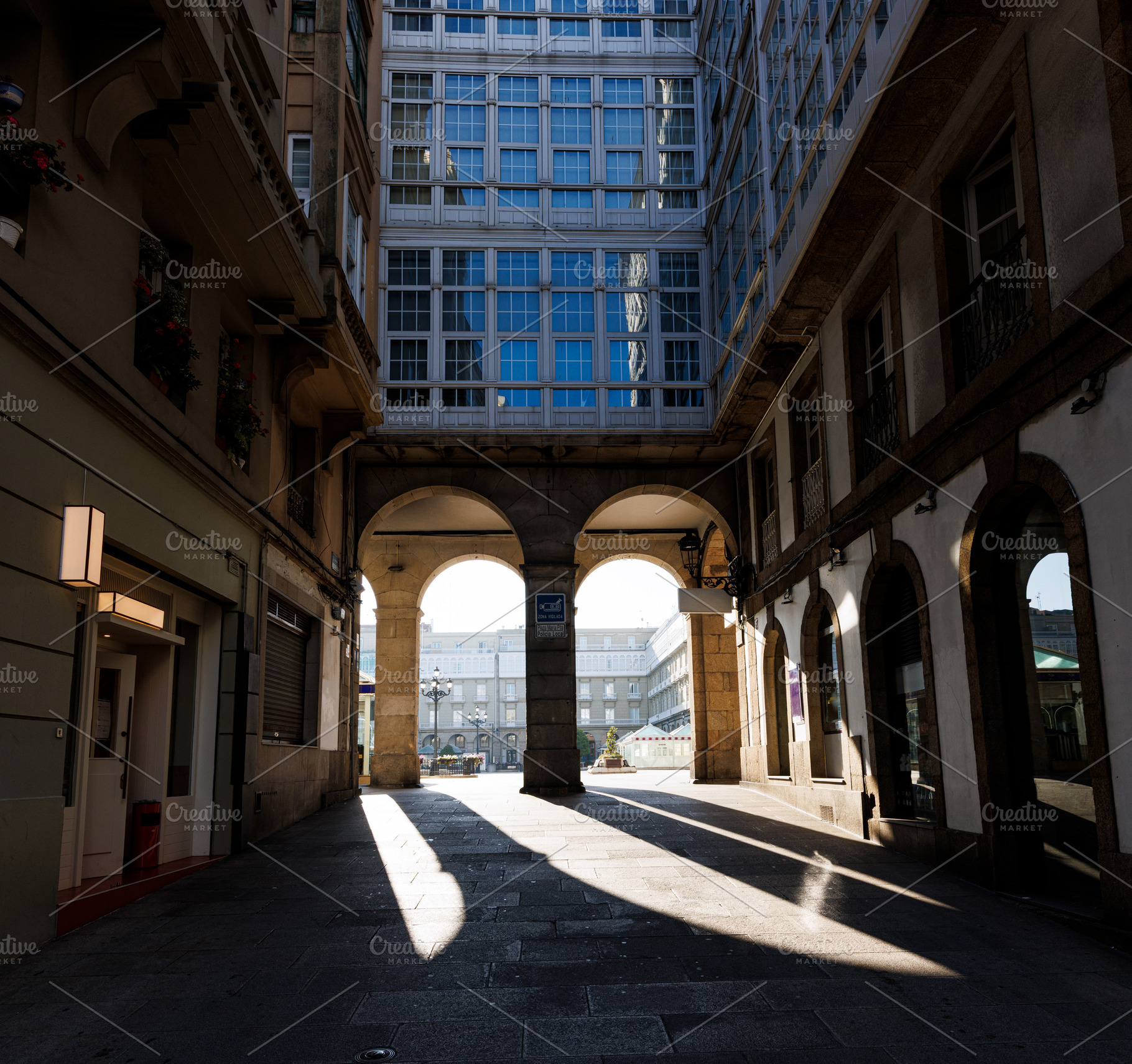 Looking through the arcades of Maria Pita Square in La Coruna, S, an Architecture Photo by Bepslabor