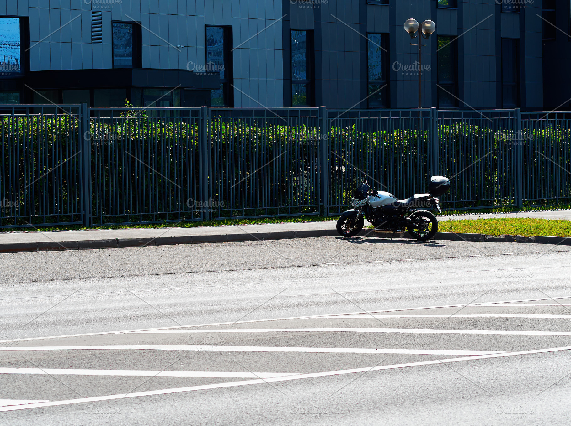 Right aligned motorcycle on empty parking backdrop, a Transportation Photo by RETROWAVE '88