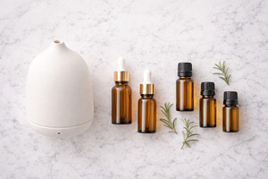 Essential oil bottles with diffuser, a Photo by Dvoevnore photos