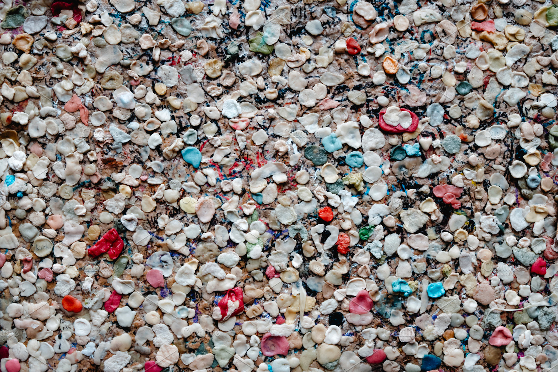chewing gums forming a colorful urban mosaic, a Photo by Nito