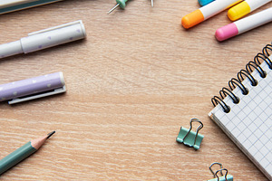 Colorful school and office supplies on wooden desk, a School & Education Photo by Olena Rudo