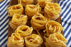 Raw Organic Dry Tagliatelle Pasta Ready to Cook, a Food & Drink Photo by LiudmylaChuhunova
