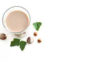 Hazelnut alternative plant-based drink background white isolated, a Food & Drink Photo by Davizro's Market
