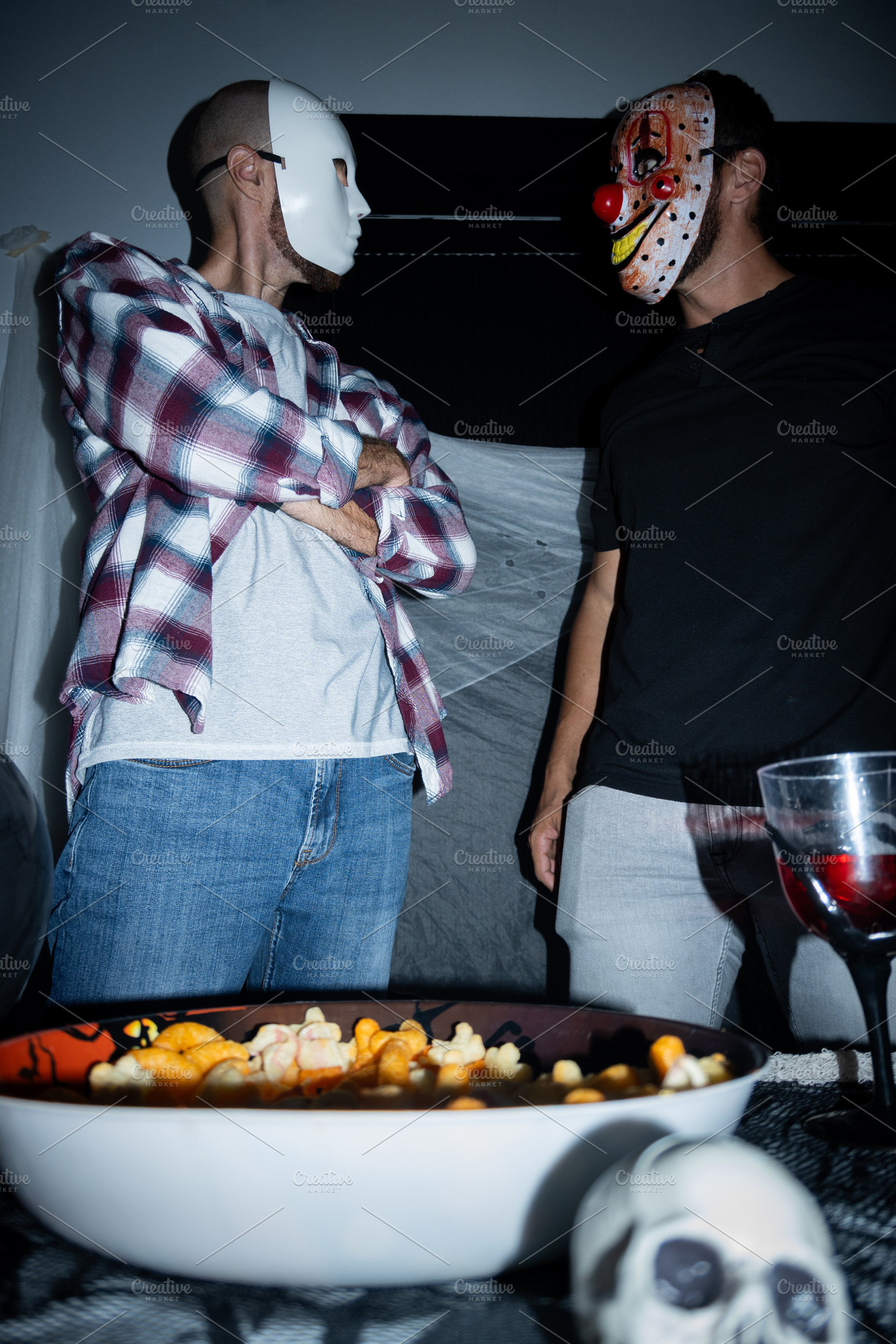 Masked men facing each other during Halloween party, a Holiday Photo by etorres69
