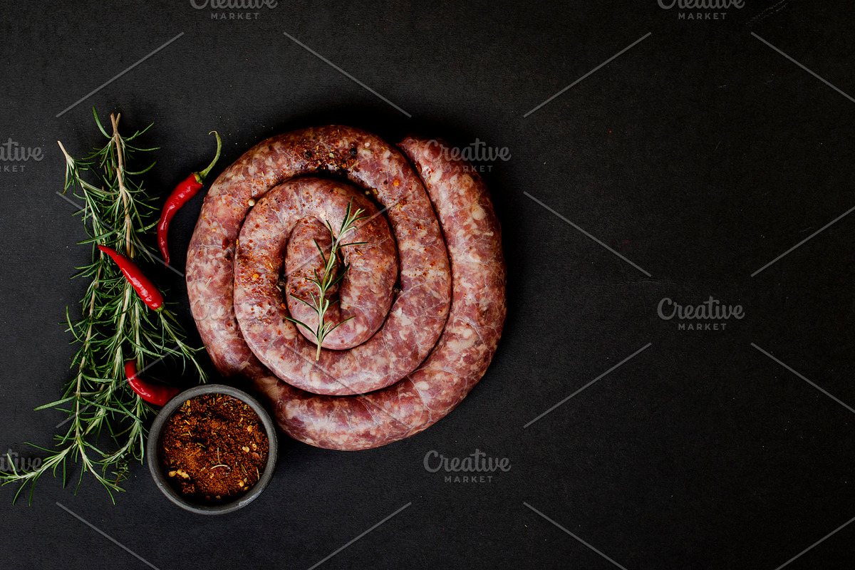 Raw beef sausages on a castiron pan  selective focus containing heap, a Food & Drink Photo by Wild Drago Shop (Photo 2 of 2)