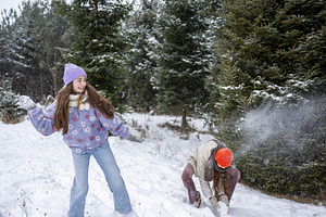 Sisters playing and throwing snow, a Sports & Recreation Photo by HalfPoint