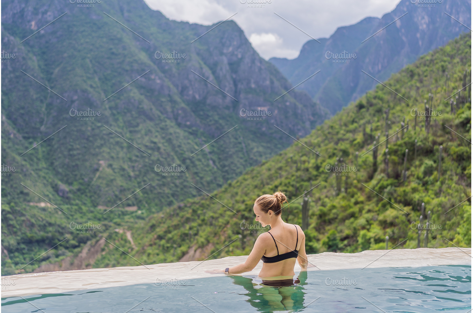 Female tourist exploring Grutas, a Nature Photo by Elizaveta Galitskaya