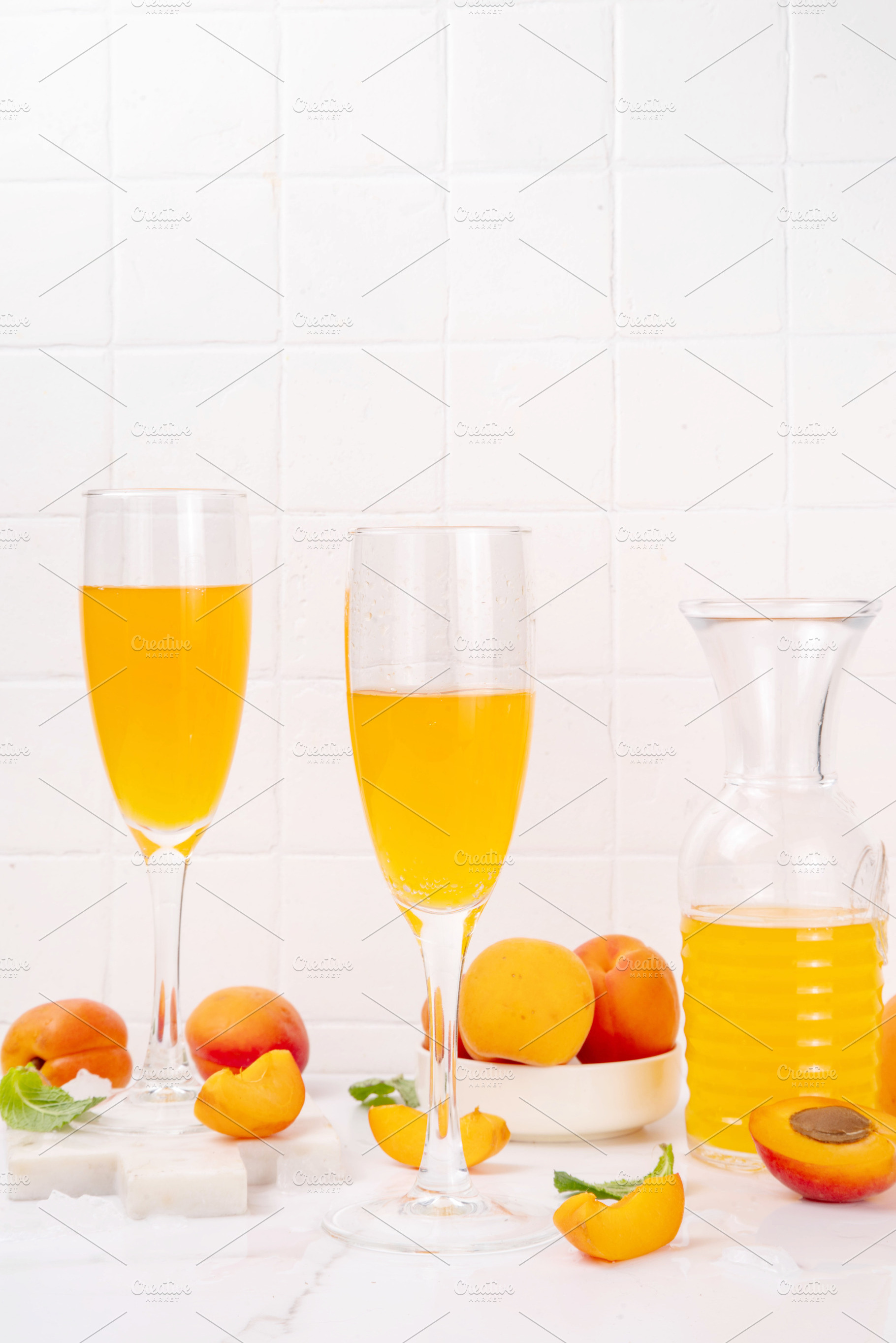 Summer sweet and tasty apricot bellini sparkling cocktail, a Food & Drink Photo by Rimma