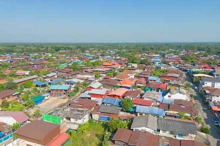 Aerial view of local residential neighborhood roofs. Urban housi