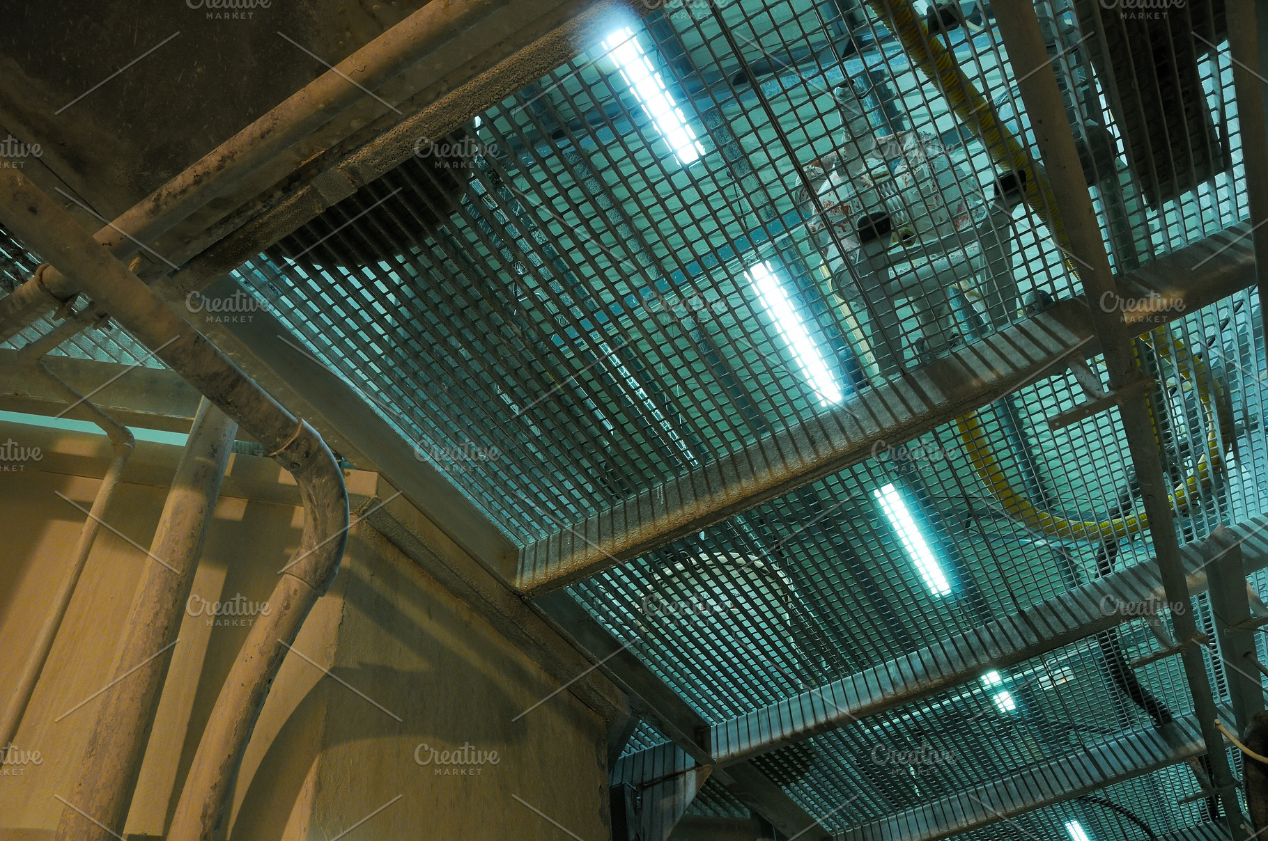 Industrial Metal Grating Ceiling with Pipes and Lights, an Industrial Photo by Davizro's Market