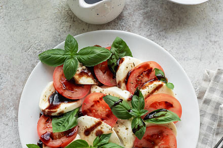 Caprese salad with tomatoes, mozzarella and basil., a Food & Drink Photo by Olena Rudo