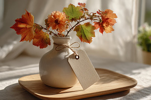 Autumnal flowers in vase with blank, a Photo by Pixeness Studio