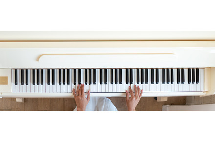Woman Enjoying Piano Lesson at Home, a School & Education Photo by undrey