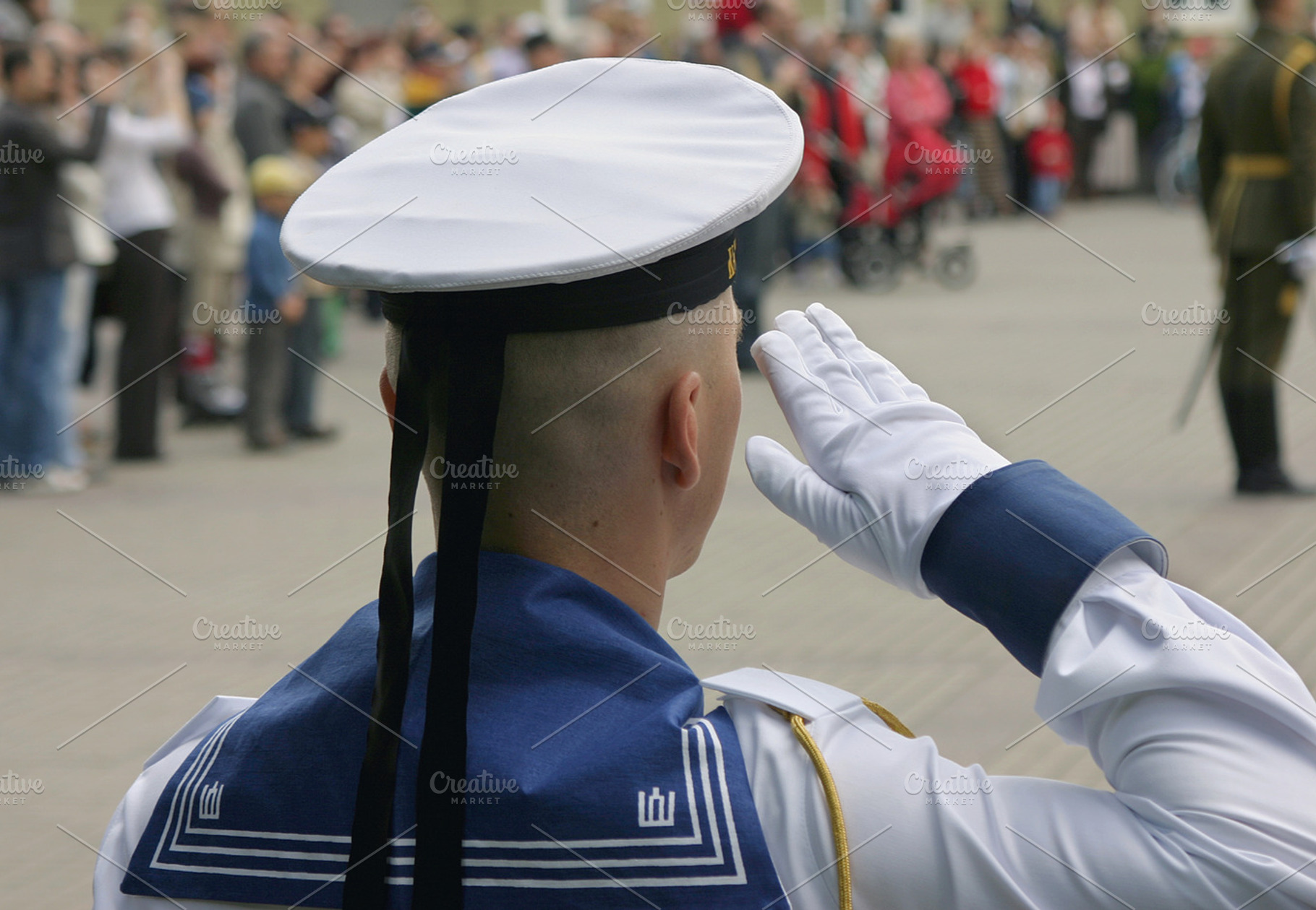 Soldier saluting at military parade, a Person Photo by BOOCYS