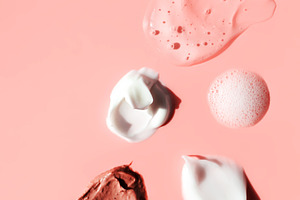 Various cosmetic smears on a pink