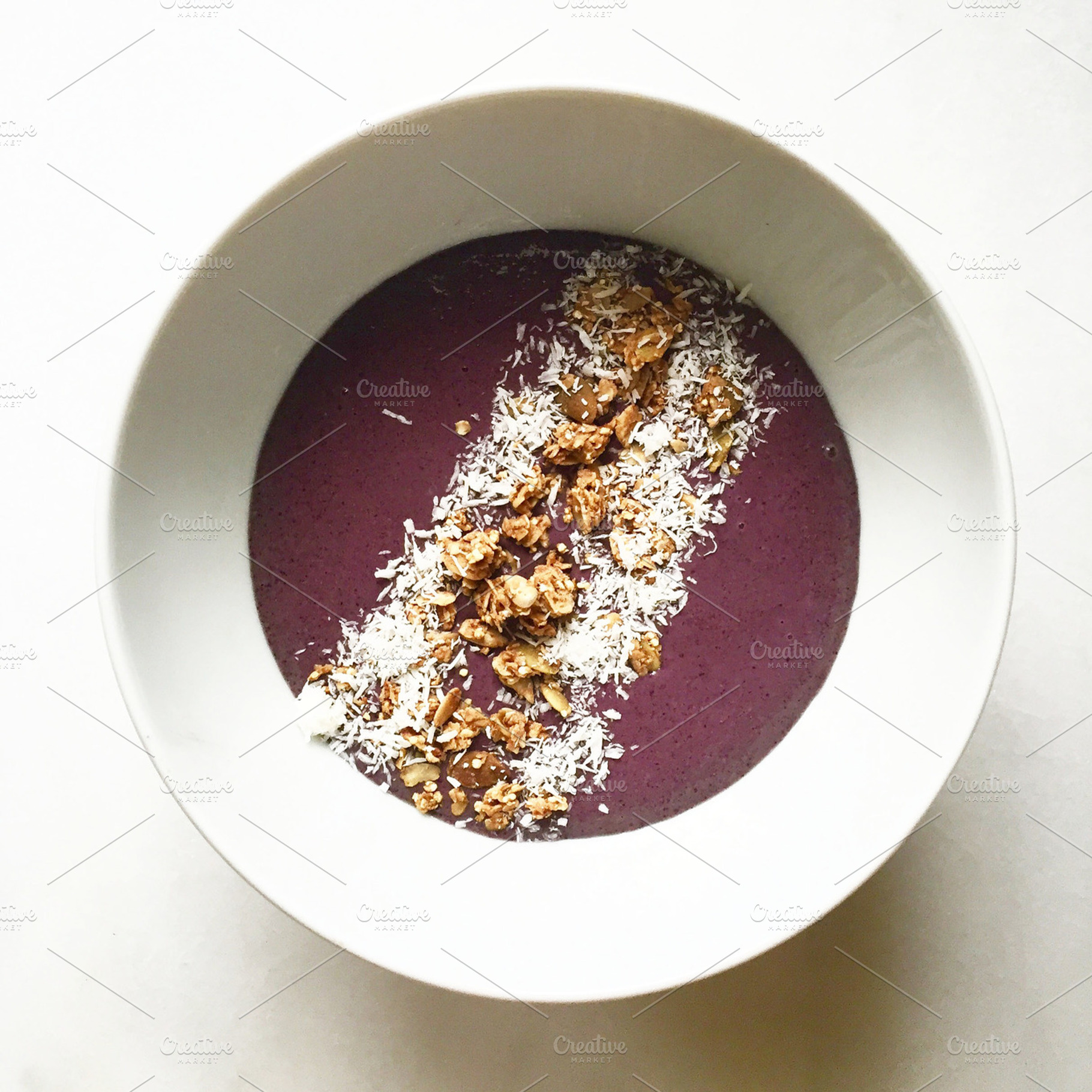Smoothie bowl on marble, a Food & Drink Photo by Claudia Petrilli Design