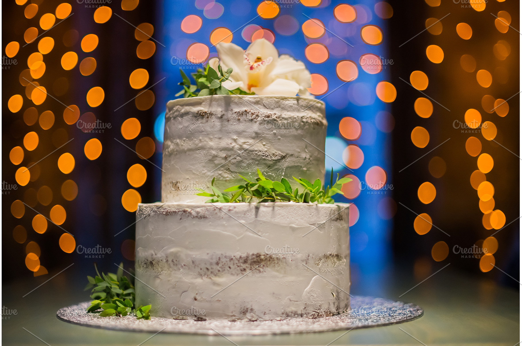 Split-level wedding cake with, a Food & Drink Photo by Elizaveta Galitskaya