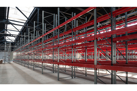 Warehouse with empty high pallet, an Industrial Photo by Jan Jack Russo Media