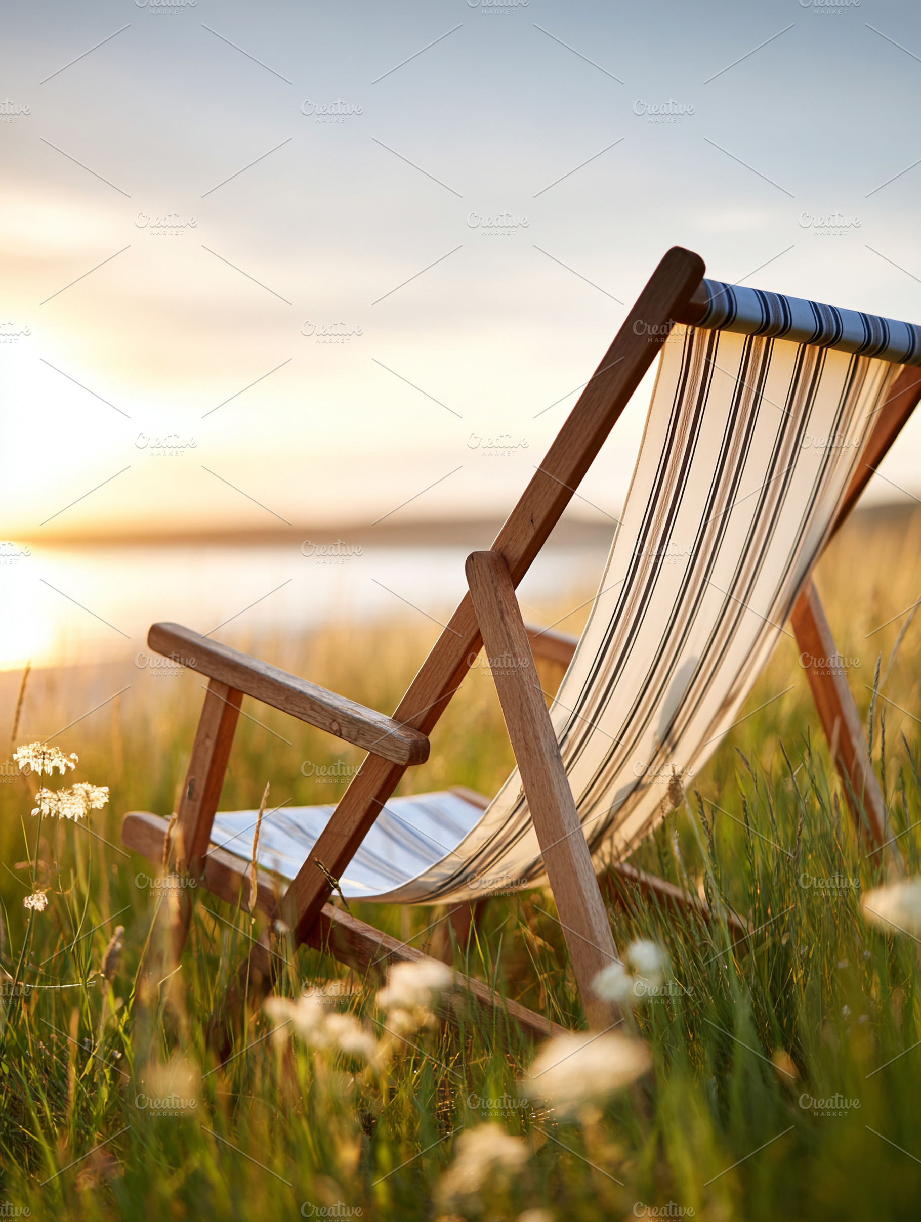 Wooden deck chair on a seaside, a Nature Photo by MistyDay