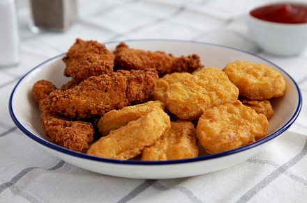 Homemade Chicken Strips and Nuggets with Ketchup, a Food & Drink Photo by LiudmylaChuhunova