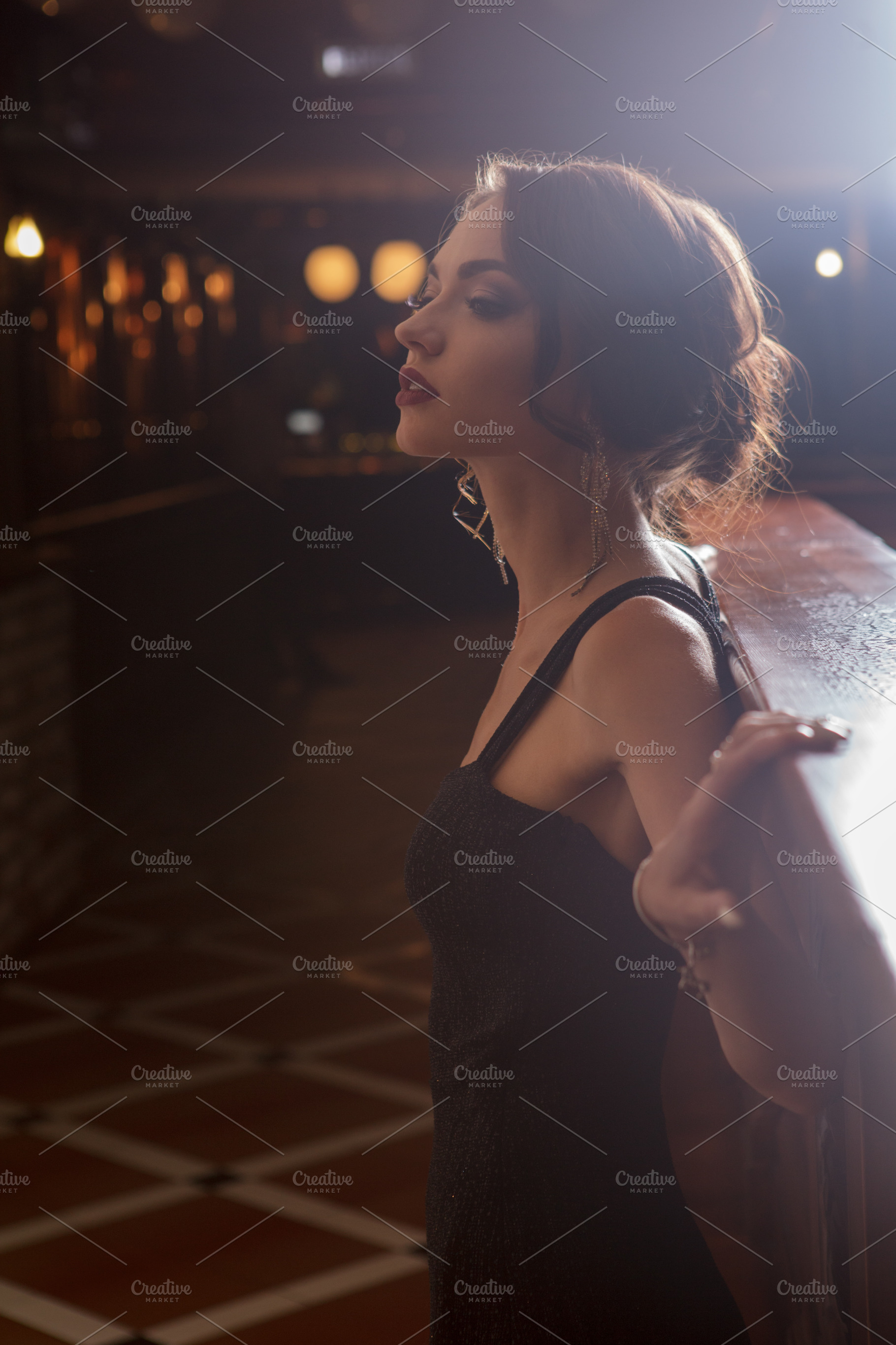 Elegant lady in black dress in featuring restaurant, woman, and elegant, a Person Photo by sport&beauty stock photo