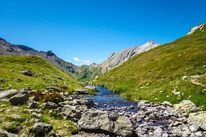 Clear mountain stream flowing in alpine valley, France, a Nature Photo by GoodGoods
