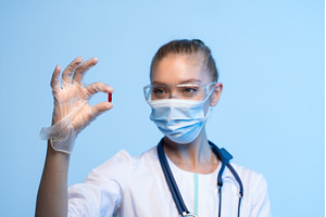 Doctor or scientist holding a red, a Health & Medical Photo by volodymyrshtun13795