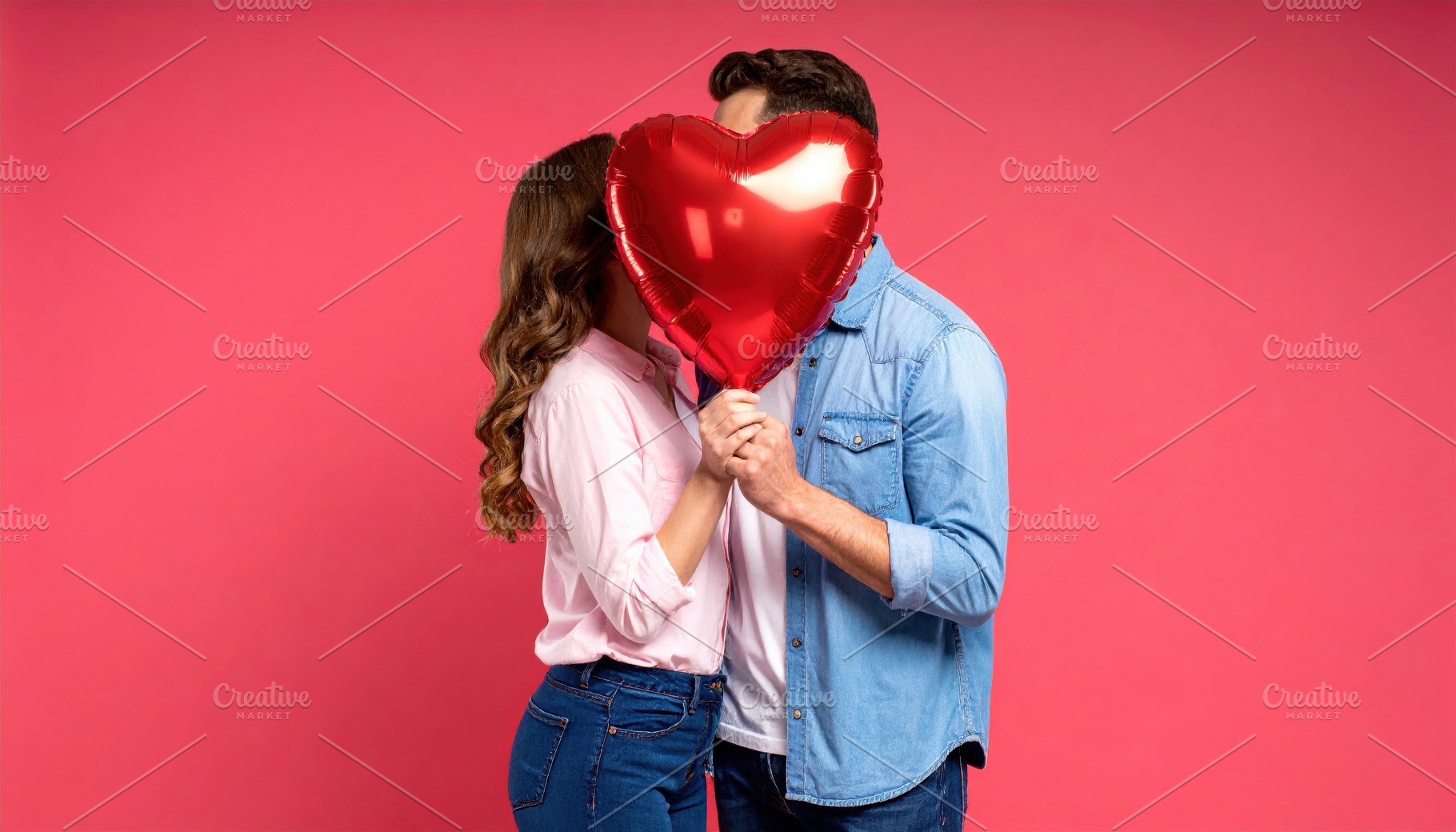 Romantic couple hiding behind heart balloon, a Holiday Photo by Davizro's Market