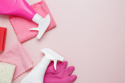 Household cleaning and hygiene concept. Pink cleaning supplies including rubber, a Photo by matucha
