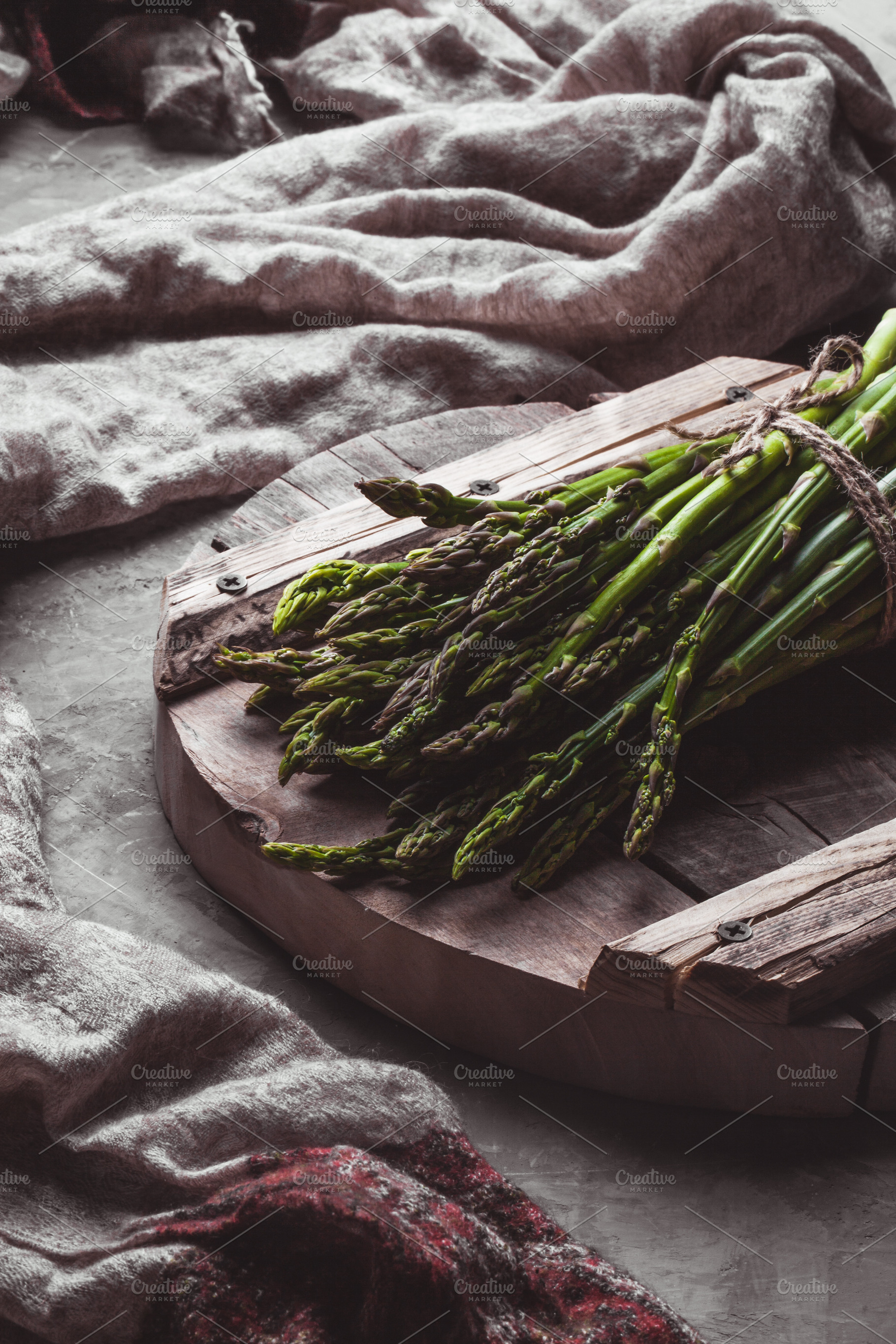 Asparagus on a cutting board health containing background, food, and spring, a Food & Drink Photo by OS