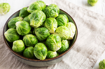 Raw Organic Brussel Sprouts in a Bowl, low angle view., a Food & Drink Photo by LiudmylaChuhunova
