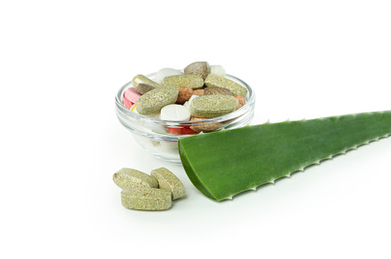 Aloe leaf and pills isolated on white background, a Beauty & Fashion Photo by AtlasStudio PRO