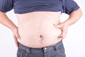 Fat man with belly containing abdomen, adult, and background