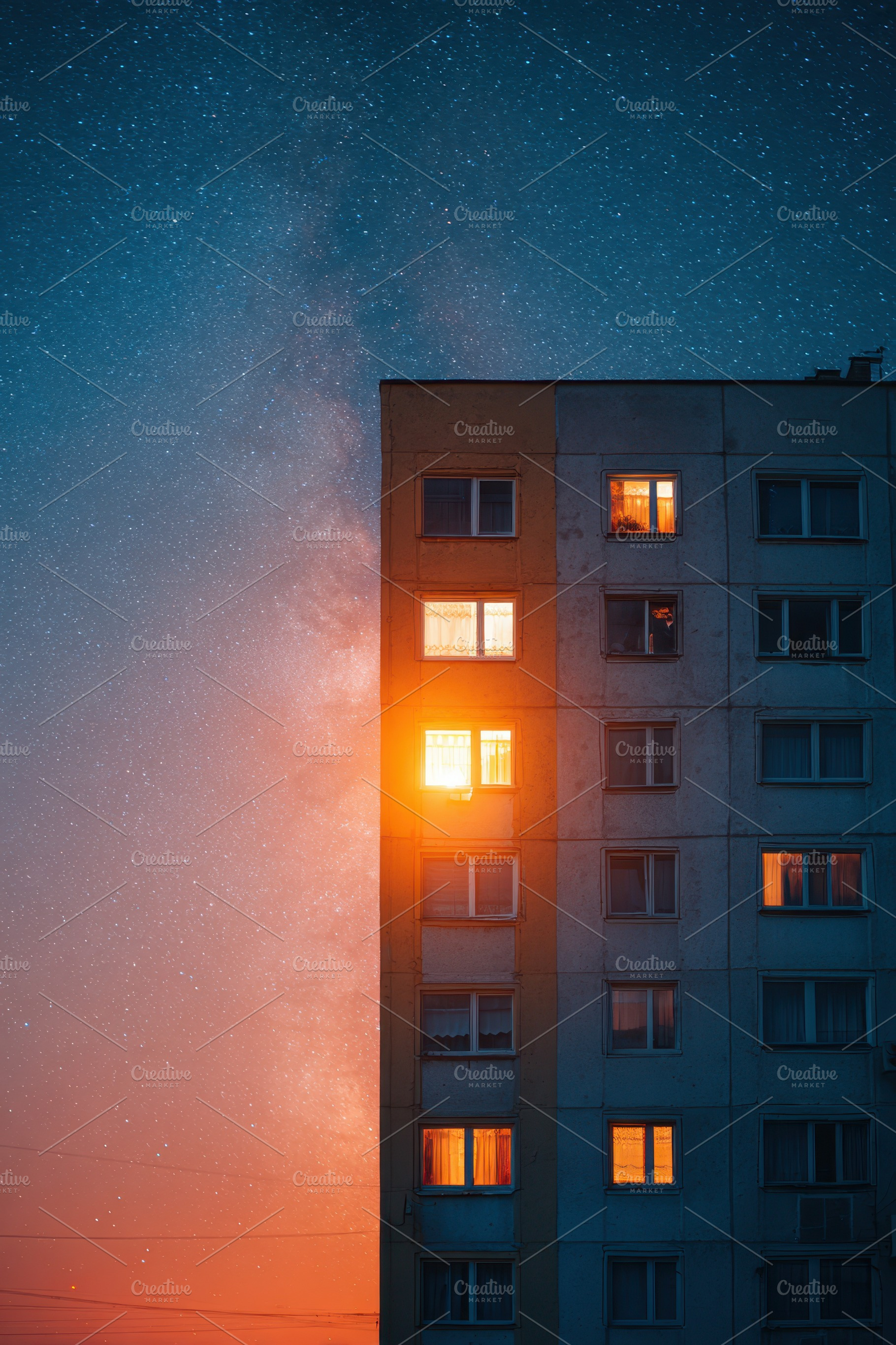 Illuminated residential building under starry sky, an Architecture Photo by AlyaAnd