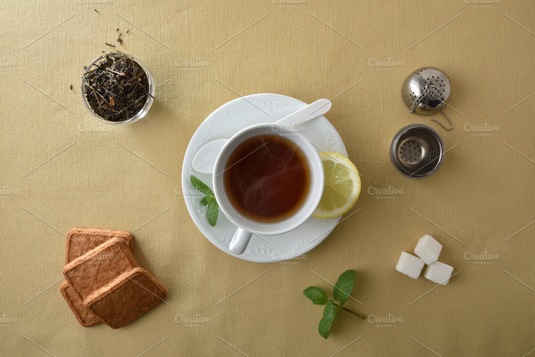 Teacup isolated in the center on brown tablecloth with ingredien, a Food & Drink Photo by Davizro's Market