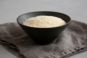 Organic Parmigiano Reggiano Parmesan Cheese Grated in a Bowl, si, a Food & Drink Photo by LiudmylaChuhunova