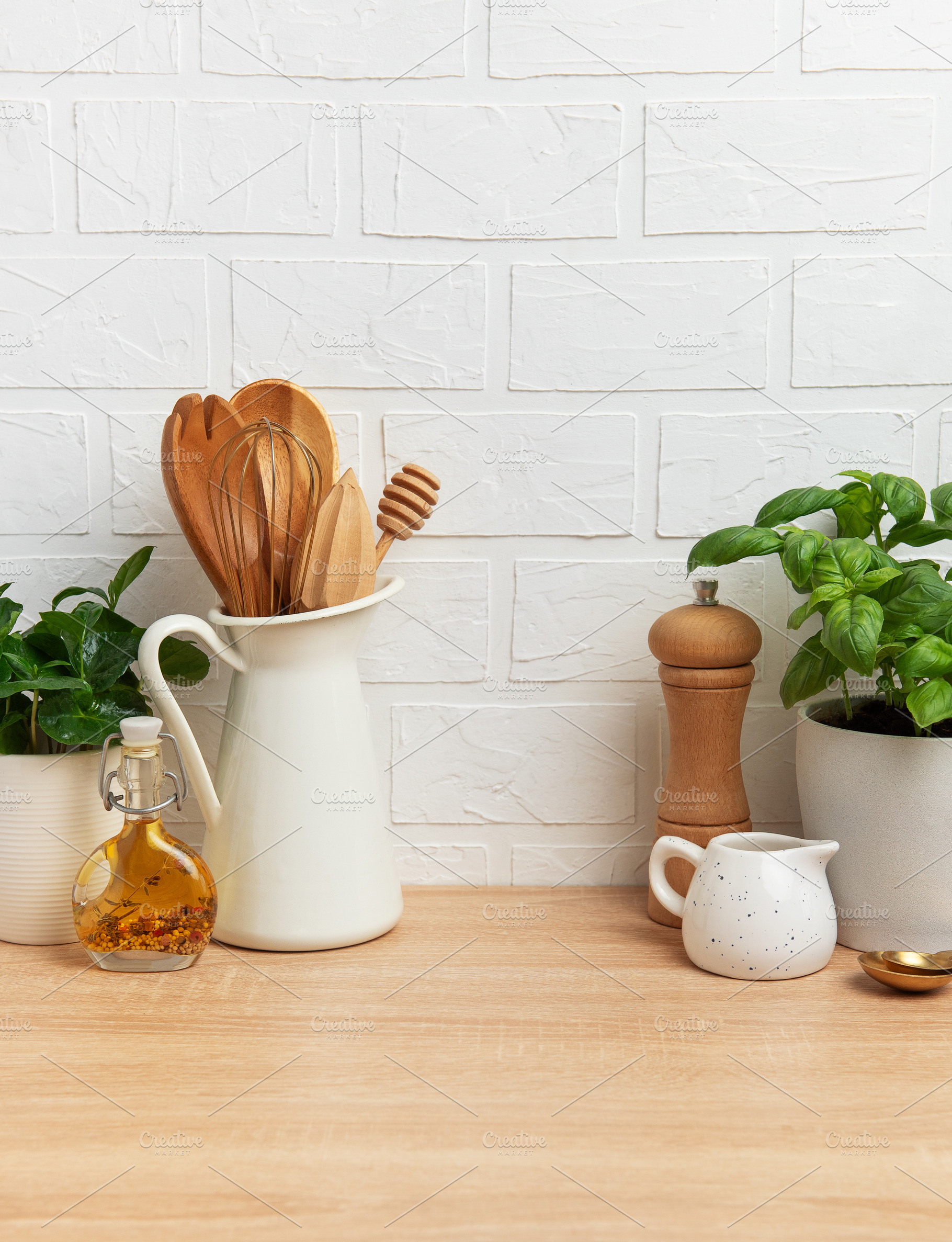 Kitchen utensils and ingredients resting on wooden countertop wi, a Food & Drink Photo by Olena Rudo