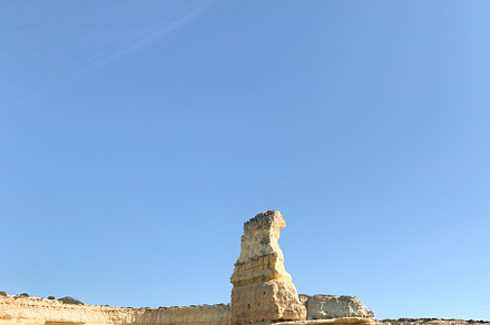 Coastal cliffs of Algarve with natural rock formations and turqu